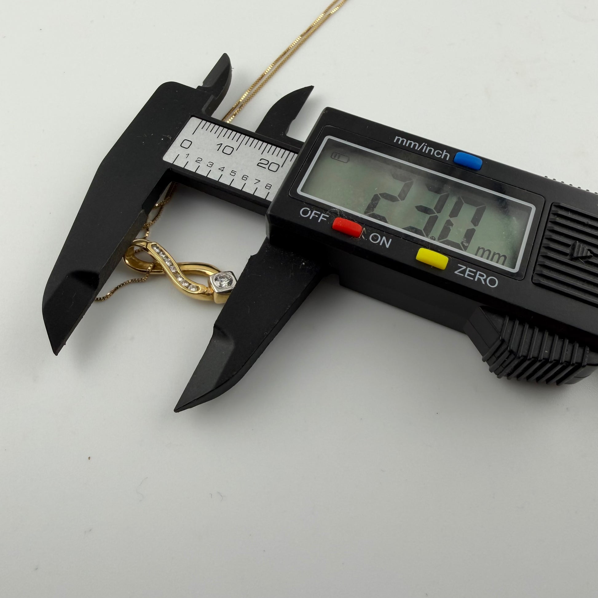 18ct Gold 0.4ct Diamond Pendant on 18in Box Chain, Hallmarked 4.1g, digital caliper measures 23mm length.