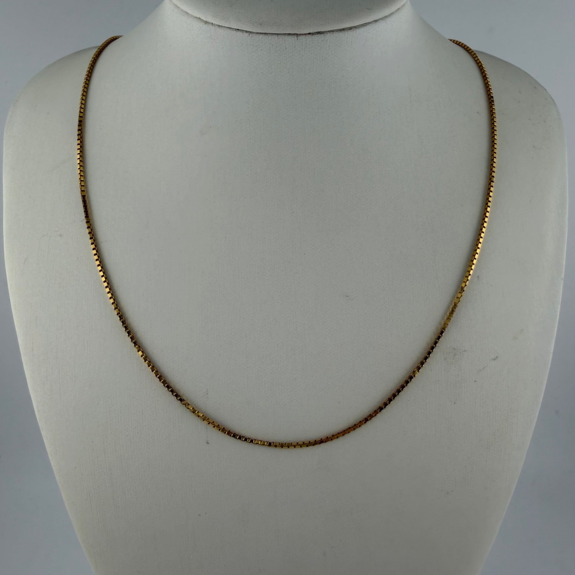 9ct gold box chain necklace, 1mm wide, 18in length, hallmarked, 2.7g weight, displayed on mannequin.