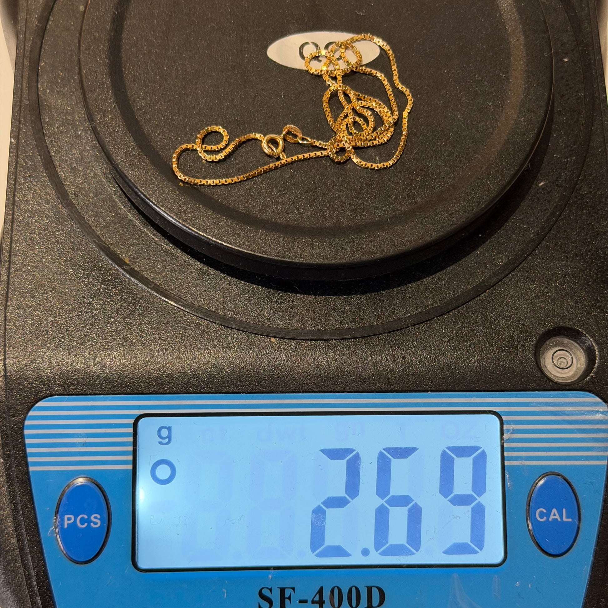9ct gold box chain, 1mm width, 18in length, hallmarked, 2.7g, on digital scale displaying 2.69g.
